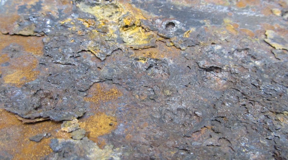 Inside of a corroded steel pipe used for slurry transport